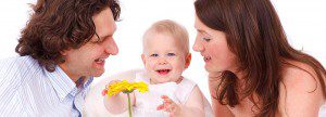 Family and baby with a flower