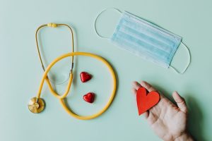 stethoscope, face mask, helping hand heart